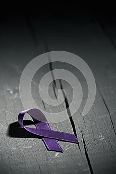 Purple ribbon against the violence against women