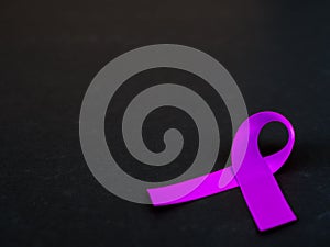 Purple ribbon awareness on black background