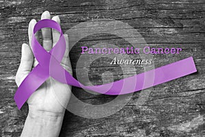 Purple ribbon with Pancreatic cancer awareness (clipping path) to support campaign and help people life
