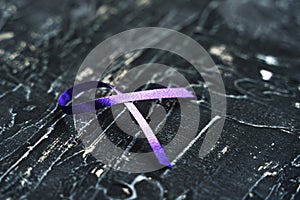 Purple ribbon-symbol of the fight against domestic violence photo