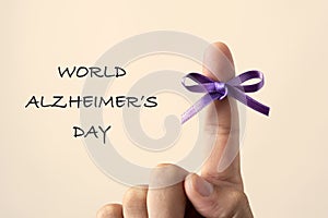 Purple ribbon and text world alzheimers day