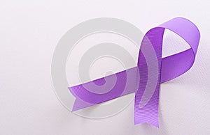 Purple ribbon on white background for supporting World Cancer Day campaign on February 4