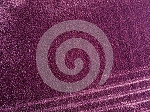 purple rug with soft fur that looks luxurious to the touch. a sloping pattern in a diagonal line.