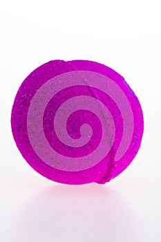 Purple salt bath ball on a white background.