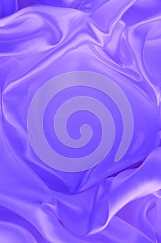 Purple satin background. Silk fabric with pleats. Satin, silk or satin creates a beautiful drape.