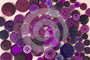 Purple sewing buttons background