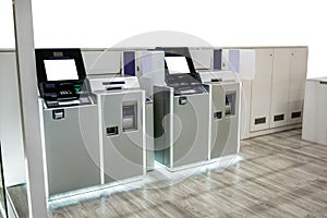 Purple and silver ATM machines station with LED light on