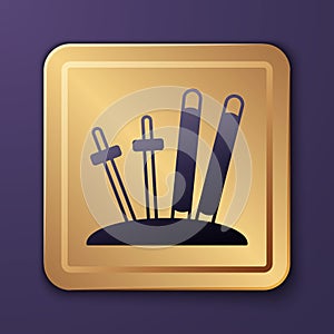 Purple Ski and sticks icon isolated on purple background. Extreme sport. Skiing equipment. Winter sports icon. Gold