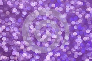 Purple sparkle abstract background. Colorful glittering background.