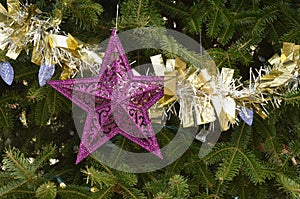 Purple star Christmas tree ornament