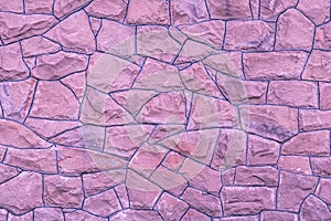 Purple stone wall background. Light pink texture of rocks. Bricks natural pattern. Abstract architecture backgrounds. Masonry roug