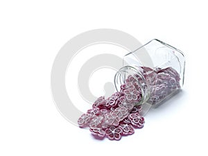 Purple sugared flowers in glass jar