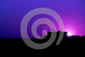 Purple sunset cityscape silhouette photo