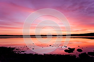 Purple sunset over sea water
