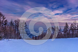 Purple sunset over ski piste