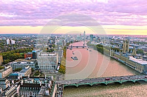 Purple sunset scenery of London city United Kingdom - Thames river, Westminster bridge and Houses of Parliament