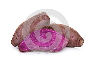Purple sweet potato or yam isolated on white