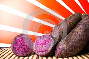 Purple Sweet Potatoes on a table with japanese rising sun background