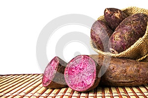 Purple Sweet Potatoes on a table with white background