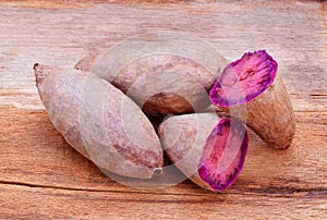 Purple Sweet Potatoes on a wooden table