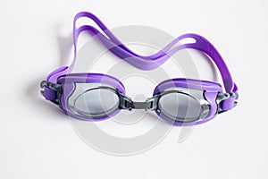 Purple swim goggles on white background