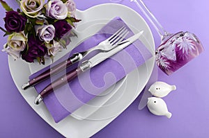 Purple theme wedding table place setting.