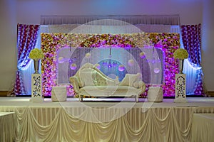 Purple themed wedding stage decorations