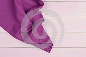 Purple towel over wooden table