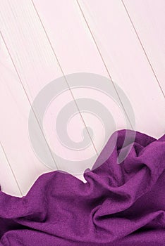 Purple towel over wooden table