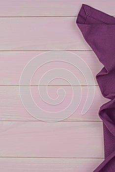 Purple towel over wooden table