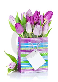 Purple tulip bouquet in gift bag