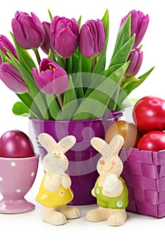 Purple tulips in bucket and two rabbits