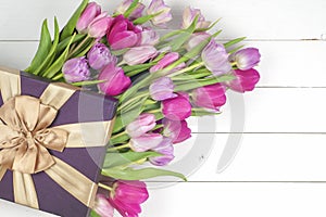 Purple tulips and gift box