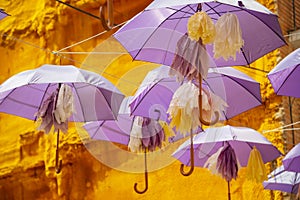 Purple umbrellas hanged in main street in Brihuega, Guadalajara