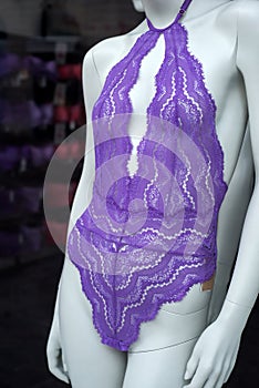 purple underwear on mannequin in a fashion store showroom