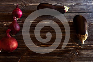 Purple vegetables on black wooden boards