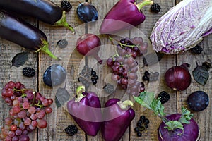 Purple vegetables and fruits. Plum, eggplant, pepper, blueberries, rowanberry. Violet organic foods high in antioxidants, anthocya