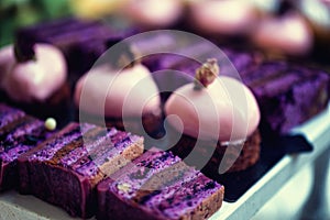 Purple velvet cake with vegan white chocolate icing and macaroon