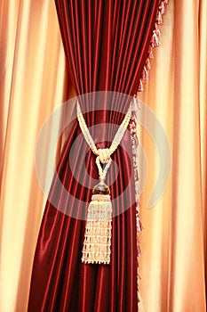 Purple velvet curtain with golden tassel photo