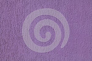Purple wall, texture, background. Plastered building wall, painted with violet water-based paint