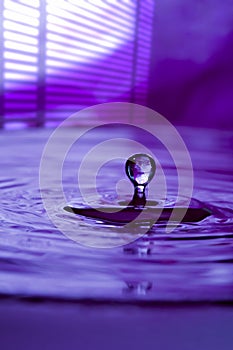 Purple water drop and splash