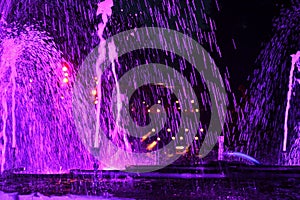 Purple water-fontain at night photo