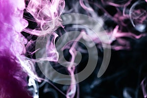 purple wavy smoke black background. High quality photo