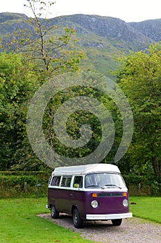Purple and white camper van