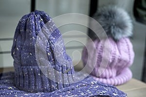 purple woolen hats in a fashion store showroom
