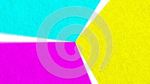 Purple yellow & teal paper spinning in a rotating wheel of textured color rough paper triangle shapes with seamless loop