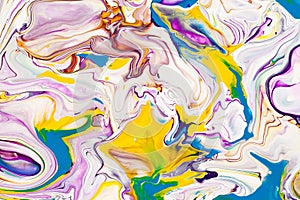 Purple and yellow vibrant abstract marbled texture. Vibrant, colorful, liquid, fluid art background.