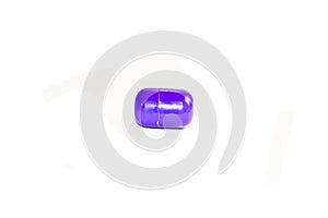 Purpple  capsule isolated. View left photo