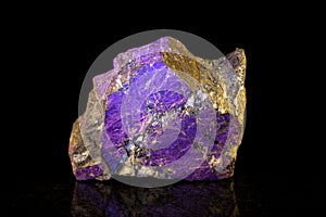 Purpurite mineral stone in front of black