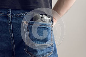A purse in jeans pocket